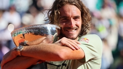 Greece's Stefanos Tsitsipas celebrates with the trophy after winning the final match against Spain's Alejandro Davidovich Fokina (REUTERS)