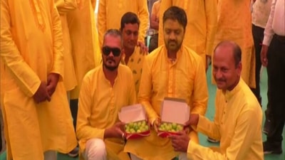 Rajkot: Guests at a wedding pose for camera as they gift lemons to the groom. (ANI)