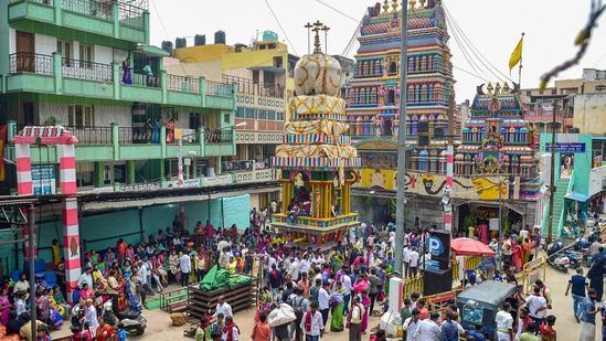 Bengaluru: Devotees gather at the Dharamraya Swamy temple during the celebration of Karaga festival, in Bengaluru, Saturday, April 16, 2022. The festival is celebrated annually in the Chaitra (March/April) month of Hindu calendar in the South Indian State of Karnataka, mainly by the Tigala community. (PTI Photo/Shailendra Bhojak) (PTI04_16_2022_000178A)(PTI)