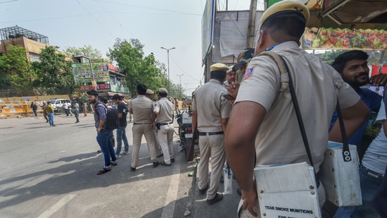 New Delhi: Security personnel stand guard after clashes broke out between two communities during a Hanuman Jayanti procession on Saturday, at Jahangirpuri in New Delhi, Sunday, April 17, 2022. (PTI Photo/Shahbaz Khan)(PTI04_17_2022_000017A)(PTI)
