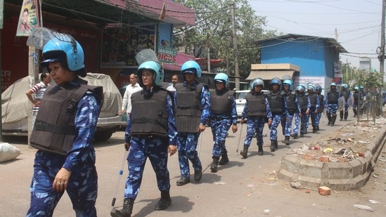 Rapid Action Force personnel patrol after violent clashes between two communities at Jahangirpuri in New Delhi,.(PTI) Rapid Action Force personnel patrol after violent clashes between two communities at Jahangirpuri in New Delhi,.(PTI)