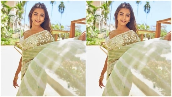 Pooja’s pastel green saree came decorated at the borders in white threads and silver mirror work is absolutely gorgerous (Instagram/@hegdepooja)