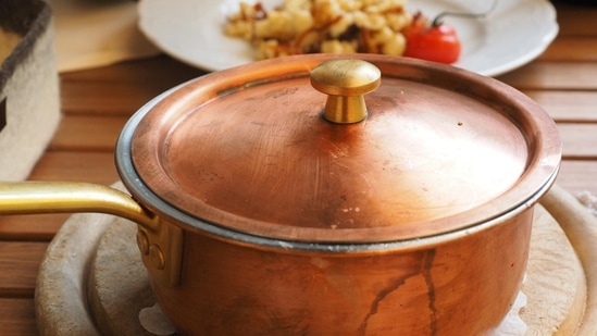 A selection of iron and iron-alloy cooking pots after use in the