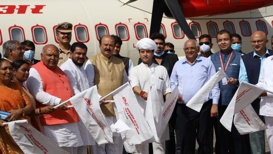 Civil Aviation Minister Jyotiraditya Scindia flags off maiden flight between Mumbai and Gujarat's Keshod.