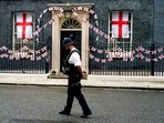 A police officer walks past 10 Downing Street decorated with England flags, in London (AP Photo/Alberto Pezzali)(AP) A police officer walks past 10 Downing Street decorated with England flags, in London (AP Photo/Alberto Pezzali)(AP)