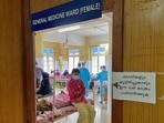 A man looks out from a Covid ward at a hospital in Manjeri, Kerala.