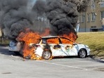 Smoke billows from a burning car during a riot ahead of a demonstration planned by Danish anti-Muslim politician Rasmus Paludan and his Stram Kurs party.
