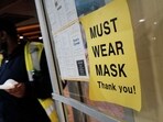A sign on a door asks people to wear masks. (Representational image)