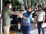 A healthcare worker collects the swab sample of a woman for Covid-19 testing, in Gurugram on Monday. (ANI)(HT_PRINT) A healthcare worker collects the swab sample of a woman for Covid-19 testing, in Gurugram on Monday. (ANI)(HT_PRINT)
