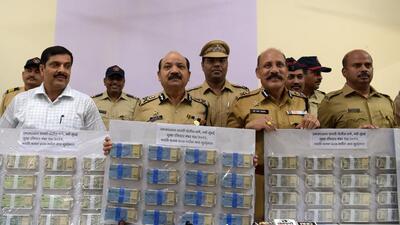 Navi Mumbai Commissioner of Police, Bipin Kumar Singh (front, middle) with the recovered cash in CBD Belapur on Monday after the van driver, who fled with ₹82.50 lakh cash meant for ATM machines, was arrested. (BACHCHAN KUMAR/HT PHOTO) Navi Mumbai Commissioner of Police, Bipin Kumar Singh (front, middle) with the recovered cash in CBD Belapur on Monday after the van driver, who fled with ₹82.50 lakh cash meant for ATM machines, was arrested. (BACHCHAN KUMAR/HT PHOTO)