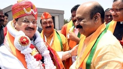 BJP president JP Nadda being received by Karnataka chief minister Basavaraj Bommai at Jindal Vijaynagar airport in Toranagallu on Sunday. (ANI)