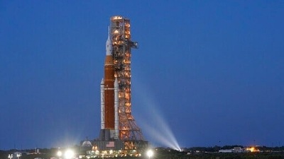 The NASA Artemis rocket with the Orion spacecraft aboard leaves the Vehicle Assembly Building moving slowly on an 11-hour journey to pad 39B at the Kennedy Space Center in Cape Canaveral. (AP)