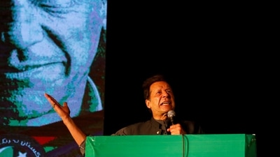 Ousted Pakistani Prime Minister Imran Khan gestures as he addresses supporters during a rally, in Karachi, Pakistan. (REUTERS)