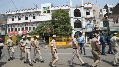 Security personnel stand guard on Monday at Jahangirpuri in New Delhi after clashes broke out between two communities during a Hanuman Jayanti procession on Saturday, (PTI) Security personnel stand guard on Monday at Jahangirpuri in New Delhi after clashes broke out between two communities during a Hanuman Jayanti procession on Saturday, (PTI)