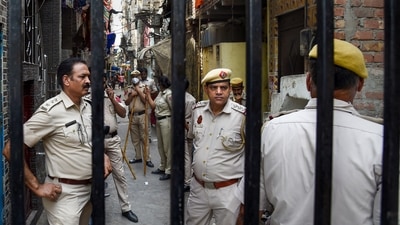 Tight security after clashes broke out between two communities during a Hanuman Jayanti procession at Jahangirpuri in New Delhi on Saturday. (PTI) Tight security after clashes broke out between two communities during a Hanuman Jayanti procession at Jahangirpuri in New Delhi on Saturday. (PTI)