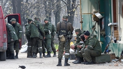 Ukraine war: Service members of pro-Russian troops gather in a street during Ukraine-Russia conflict in the southern port city of Mariupol,&nbsp; (REUTERS)