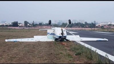 A training aircraft toppled over during landing at the Jakkur Aerodrome in Bengaluru on Sunday evening. One person sustained injuries while the other escaped unhurt, said police. A training aircraft toppled over during landing at the Jakkur Aerodrome in Bengaluru on Sunday evening. One person sustained injuries while the other escaped unhurt, said police.