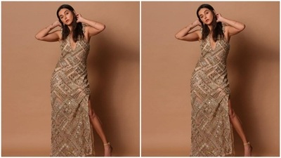 Shibani posed like a diva in the two thigh high slits of the gown. She also opted for nude stilettos to complete her look. (Instagram/@shibanidandekar)