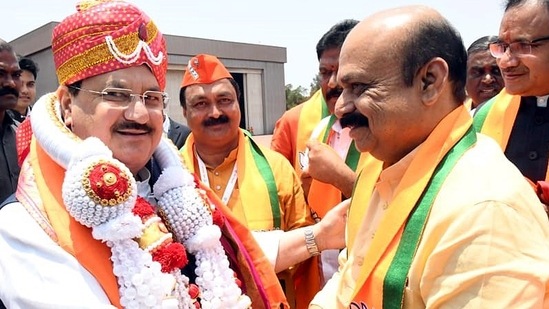 BJP president JP Nadda being received by Karnataka chief minister Basavaraj Bommai at Jindal Vijaynagar airport in Toranagallu on Sunday.(ANI)
