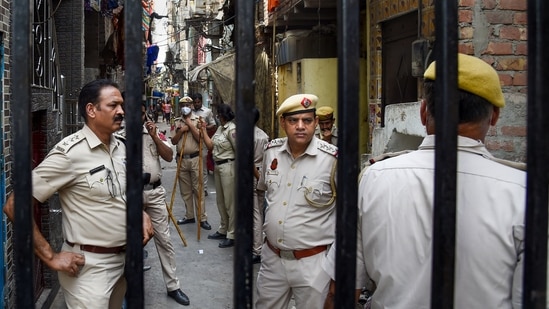 Tight security after clashes broke out between two communities during a Hanuman Jayanti procession at Jahangirpuri in New Delhi on Saturday.(PTI) Tight security after clashes broke out between two communities during a Hanuman Jayanti procession at Jahangirpuri in New Delhi on Saturday.(PTI)