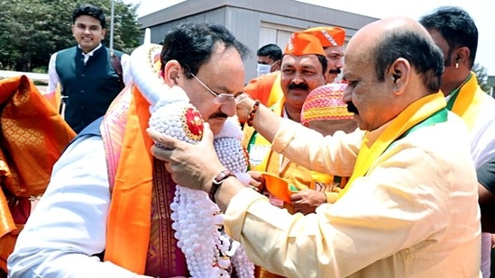 Bharatiya Janata Party national president JP Nadda being welcomed by Karnataka chiefminister Basavaraj S Bommai on his arrival at Jindal Airport, Touranagallu, in Bellary on Sunday. (ANI)(HT_PRINT)