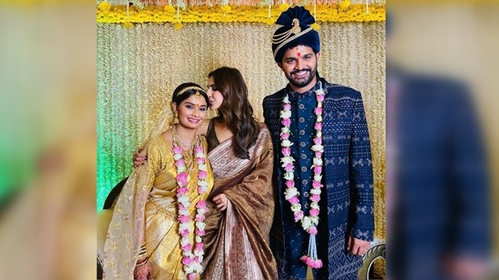 In another, Vaani Kapoor posed with the bride and groom. She stood in between the couple and kissed her friend's forehead.(Instagram/@_vaanikapoor_)