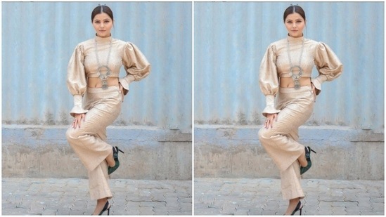 Rubina paired a pastel gold cropped top with turtleneck details and voluminous sleeves and frills with a pair of high-waisted pastel gold trousers with wide legs.(Instagram/@rubinadilaik)
