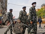 Paramilitary personnel patrol a site after clashes broke out between two communities during the procession on Hanuman Jayanti, at Jahangirpuri, in New Delhi on Tuesday.