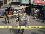 Security personnel keep vigil after clashes broke out between two communities during a Hanuman Jayanti procession on Saturday, at Jahangirpuri in New Delhi, Monday, April 18, 2022. (PTI Photo/Shahbaz Khan)