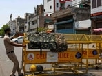 Security forces place barricades at the site of communal clash during a religious procession in Delhi’s Jahangirpuri area. (HT Photo/Amal KS)