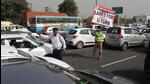 Traffic marshalls directing vehicles towards the temporary U-turn near Kherki Daula toll plaza in Gurugram on Tuesday. (Vipin Kumar/HT PHOTO) Traffic marshalls directing vehicles towards the temporary U-turn near Kherki Daula toll plaza in Gurugram on Tuesday. (Vipin Kumar/HT PHOTO)