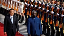 Chinese Premier Li Keqiang, left, and Solomon Islands Prime Minister Manasseh Sogavare review an honor guard during a welcome ceremony at the Great Hall of the People in Beijing, Wednesday, Oct. 9, 2019. (AP Photo/Mark Schiefelbein, File) Chinese Premier Li Keqiang, left, and Solomon Islands Prime Minister Manasseh Sogavare review an honor guard during a welcome ceremony at the Great Hall of the People in Beijing, Wednesday, Oct. 9, 2019. (AP Photo/Mark Schiefelbein, File)