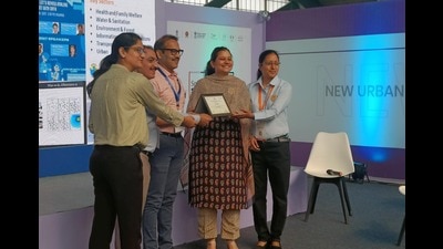 Chandigarh Smart City Limited CEO Anindita Mitra receiving an award from Kunal Kumar, joint secretary-cum-mission director, Smart Cities Mission, in Surat on Tuesday. (HT Photo)
