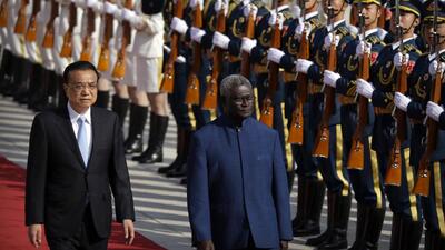 Chinese Premier Li Keqiang (left) and Solomon Islands Prime Minister Manasseh Sogavare review an honour guard during a welcome ceremony at the Great Hall of the People in Beijing on Wednesday. (AP/ FILE) Chinese Premier Li Keqiang (left) and Solomon Islands Prime Minister Manasseh Sogavare review an honour guard during a welcome ceremony at the Great Hall of the People in Beijing on Wednesday. (AP/ FILE)