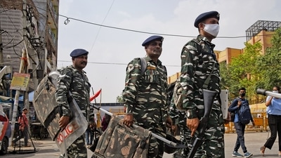 Paramilitary personnel patrol a site after clashes broke out between two communities during the procession on Hanuman Jayanti, at Jahangirpuri, in New Delhi on Tuesday. (ANI) Paramilitary personnel patrol a site after clashes broke out between two communities during the procession on Hanuman Jayanti, at Jahangirpuri, in New Delhi on Tuesday. (ANI)