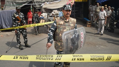 Security personnel keep vigil after clashes broke out between two communities during a Hanuman Jayanti procession on Saturday, at Jahangirpuri in New Delhi, Monday, April 18, 2022. (PTI Photo/Shahbaz Khan) Security personnel keep vigil after clashes broke out between two communities during a Hanuman Jayanti procession on Saturday, at Jahangirpuri in New Delhi, Monday, April 18, 2022. (PTI Photo/Shahbaz Khan)