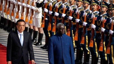 Chinese Premier Li Keqiang, left, and Solomon Islands Prime Minister Manasseh Sogavare review an honor guard during a welcome ceremony at the Great Hall of the People in Beijing in 2019. (File image) (AP)