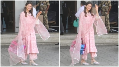 Alia opted for side-parted open tresses, nude pink lip shade, blushed cheeks, dainty bindi, glowing skin and minimal makeup. If you want to upgrade your traditional summer wardrobe, don't forget to take tips from Alia's airport look. (HT Photo/Varinder Chawla) Alia opted for side-parted open tresses, nude pink lip shade, blushed cheeks, dainty bindi, glowing skin and minimal makeup. If you want to upgrade your traditional summer wardrobe, don't forget to take tips from Alia's airport look. (HT Photo/Varinder Chawla)