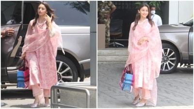 Alia teamed the kurta with blush pink flared pants adorned with silver patti borders on the hem. She rounded off the look with an organza dupatta decorated with white lace patti border and a matching floral print in a dark pink shade over a blush pink background. (HT Photo/Varinder Chawla) Alia teamed the kurta with blush pink flared pants adorned with silver patti borders on the hem. She rounded off the look with an organza dupatta decorated with white lace patti border and a matching floral print in a dark pink shade over a blush pink background. (HT Photo/Varinder Chawla)
