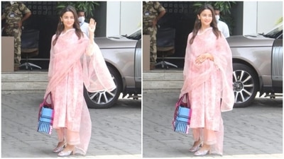 Alia's airport look featured a floral blush pink kurta adorned with spring-inspired print done in a dark pink hue. The kurta also came with long sleeves embroidered with white lace, a loose silhouette for an effortless feel to beat the heat, and a calf-grazing hem length. (HT Photo/Varinder Chawla) Alia's airport look featured a floral blush pink kurta adorned with spring-inspired print done in a dark pink hue. The kurta also came with long sleeves embroidered with white lace, a loose silhouette for an effortless feel to beat the heat, and a calf-grazing hem length. (HT Photo/Varinder Chawla)