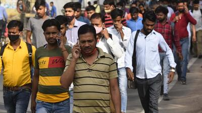 Gurugram, India - April. 19, 2022: Factory workers, some not wearing the face mask, head to work, at Udyog Vihar, in Gurugram, India, on Tuesday, April 19, 2022. (Photo by Vipin Kumar/ Hindustan Times) (Vipin Kumar/HT PHOTO) Gurugram, India - April. 19, 2022: Factory workers, some not wearing the face mask, head to work, at Udyog Vihar, in Gurugram, India, on Tuesday, April 19, 2022. (Photo by Vipin Kumar/ Hindustan Times) (Vipin Kumar/HT PHOTO)