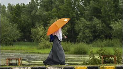 A girl walks with her umbrella in rain that lashed Srinagar on Tuesday. (PTI) A girl walks with her umbrella in rain that lashed Srinagar on Tuesday. (PTI)