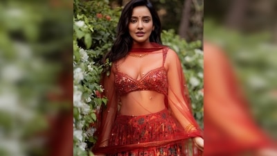 The outfit comprises a cherry red gathered lehenga in dupion silk base with floral print, a matching overlap blouse and a dupatta. (Instagram/@nehasharmaofficial) The outfit comprises a cherry red gathered lehenga in dupion silk base with floral print, a matching overlap blouse and a dupatta. (Instagram/@nehasharmaofficial)