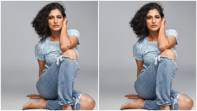 Acing the casual blue look, Kubbra Sait flaunted her flexible body through this posture. (Instagram/@kubbrasait)