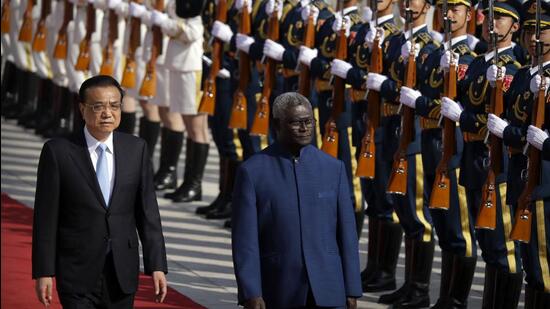 Chinese Premier Li Keqiang (left) and Solomon Islands Prime Minister Manasseh Sogavare review an honour guard during a welcome ceremony at the Great Hall of the People in Beijing on Wednesday. (AP/ FILE)