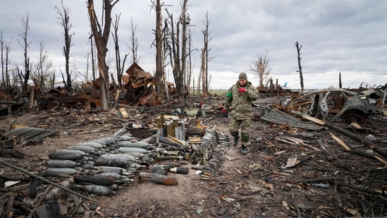 An interior ministry sapper collects unexploded shell, grenades and other devices in Hostomel, close to Kyiv, Ukraine, Monday, (File image)(AP)