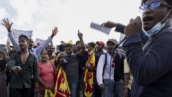 Demonstrators in front of the Old Parliament Building in Colombo on Monday. (Bloomberg)