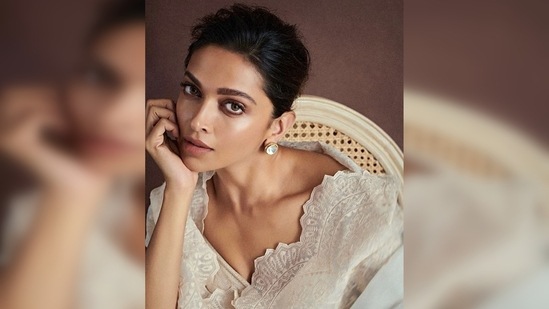 In the photos, Deepika Padukone can be seen sitting on a beige bamboo chair and giving a mesmerising pose for the camera with one hand on her cheeks and her eyes locked to the lens.(Instagram/@deepikapadukone)