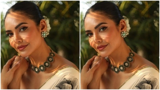 Styled by fashion stylist Chandini Whabi, Esha accessorised her look with emerald stone-studded choker and ear studs. She wore her tresses into a clean bun and added fresh flowers to it.(Instagram/@egupta)