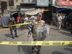 Security personnel keep vigil after clashes broke out between two communities during a Hanuman Jayanti procession on Saturday, at Jahangirpuri in New Delhi, Monday.